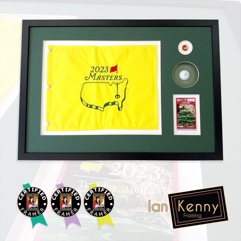 A 2023 Masters flag, pin, pass and ball in a black frame